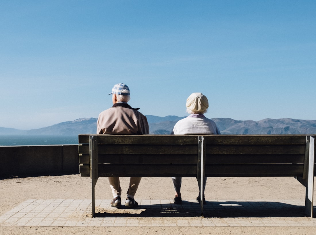 An older couple resting calmly by the Monterey coast