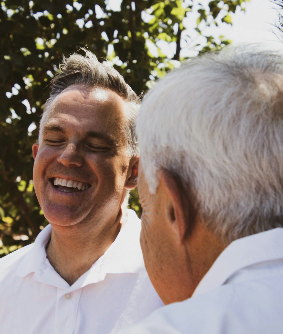 An older couple sharing a warm, reassured moment